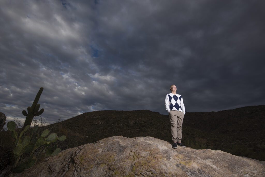 dramatic sky during tucson senior pictures for guys