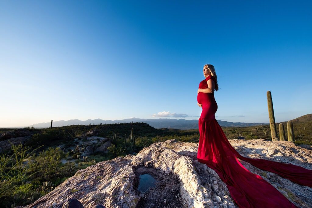 dramatic tucson maternity photo woman in red dress