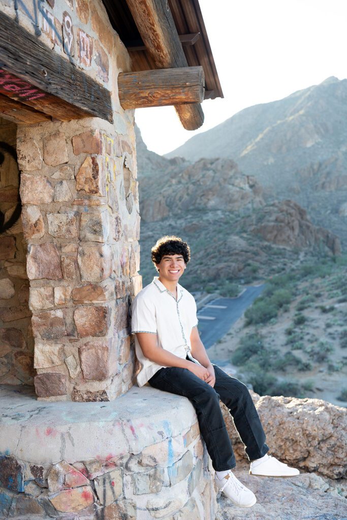High school senior boy portrait at Gates Pass stone structure in Saguaro National Park West Tucson Arizona